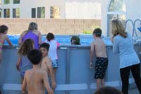 083-Ella_rinses_off_in_the_pool