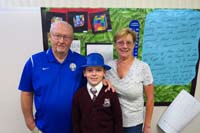 25-Kenny_with_Grandpa_Duke_and_Grammy_in_classroom