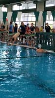 20-diving_into_the_water_during_practice_at_swim_meet_with_new_coach-Robyn