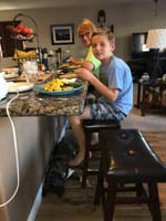 56-Rainier_really_likes_to_hang_out_below_our_feet_when_we_have_dinner_on_the_island