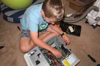 69-putting_Poppy's_old_computer_back_together-inserting_CPU-after_taking_it_apart