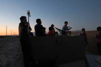04-time_to_watch_the_fireworks_from_the_roof-kids_on_elevated_planters_box