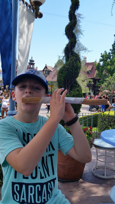 41-Kenny_playing_a_churro_like_a_flute