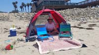 06-Daddy_hanging_out_in_our_little_tent_covering-Daddy_is_not_a_fan_of_the_sun_since_out_in_it_often