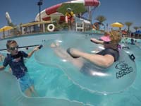 15-Kenny_holding_Mommy_and_Chloe's_raft_together