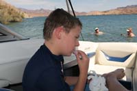 26-poor_Kenny_slipped_on_back_of_boat_getting_out_of_water_biting_his_lip-using_ice_to_stop_bleeding