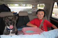 01-Day_1-away_we_go-dog_happy,kid_happy-has_headphones_and_puke_bucket_ready