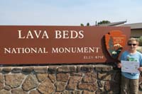67-Kenny_shows_his_Junior_Ranger_certificate_and_badge_at_Lava_Beds_NM