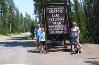 001-family_at_Crater_Lake_National_Park_entrance_sign