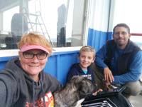 89-family_hanging_out_at_Farwest_Tire_in_Coos_Bay,OR_to_replace_worn_camper_tires