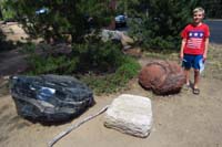004-Kenny_next_to_big_pieces_of_obsideon,pumice,cinder