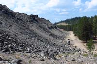 062-Big_Obsidian_Flow_meets_the_forest_on_the_trail