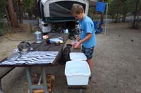 101-back_to_campsite-Kenny_does_the_dinner_dishes