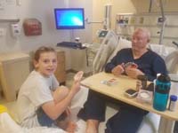 02-Kenny_visiting_Grandpa_Duke_in_hospital_due_to_bacteria_eating_skin_infection_on_head_reaching_eyes