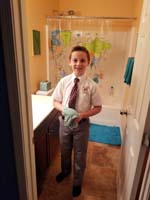 05-Kenny_ready_for_school-he_does_his_hair_himself_now