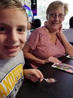 13-Kenny_with_his_spoonful_of_small_multi-colored_sugar_cubes,Grammy