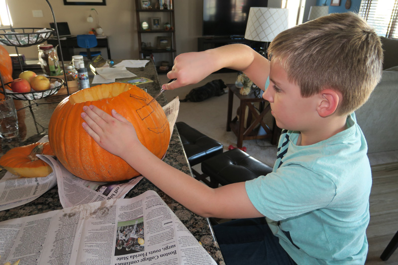 50-Kenny_carefully_carving_the_pumpkin_this_year