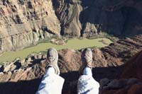 23-Daddy's_feet_dangling_over_the_side-Colorado_River_is_2850_foot_below_and_half_mile_away