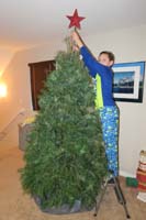 20-Kenny_puts_the_star_on_the_Christmas_tree