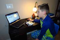 16-programming_the_Mindstorm_Lego_toy_he_got_for_Christmas