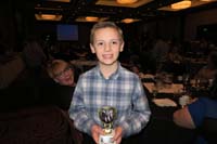 13-Kenny_shows_off_his_award