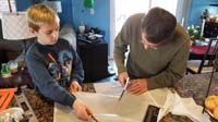 06-Daddy_helping_to_cut_a_parachute
