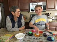 30-Baba_watches_as_Kenny_colored_Easter_eggs