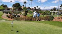 09-getting_putting_instructions_from_Grandpa_Duke_at_a_green