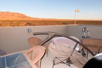 12-rooftop_deck_aftermath_from_high_wind_storm-shade_umbrella_fell_over