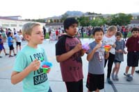 22-Kenny_shares_a_snow_cone_with_his_friends_Rishi_and_Christopher