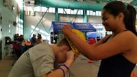 01-Nardia_helps_to_put_on_Kenny's_swim_cap_the_right_way
