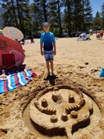 06-Kenny_worked_hard_to_build_this_sand_castle