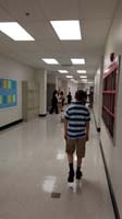 31-Kenny_walking_through_the_hall_to_meet_his_teachers