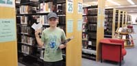 11-learning_how_to_find_reference_books_at_library-really_liked_library_since_he_loves_to_organize