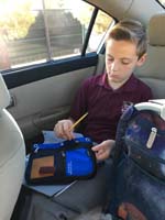 12-Kenny_in_carline_getting_ready_to_study_for_spelling_test