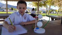 48-20181023-Science_Olympiad_Write_It_Do_It_practice_in_the_park_with_partner_Shelby-school_in_background
