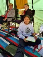 76-Kenny_and_Nardia_hanging_out_in_the_great_tent_setup-they_are_doing_homework