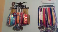 007-Kenny_is_very_proud_of_his_medal_racks_in_his_room