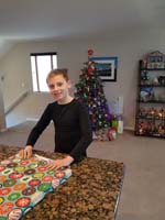 054-Kenny_wrapping_Daddy's_Christmas_gift-Daddy_out_of_screen_fixing_electronic_toy