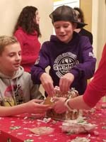 060-Kenny_leads_the_construction_of_the_ginger_bread_house-messy
