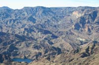 20-scenic_view_from_summit-looking_W-zoom_to_Monkey_Hole_area-dirt_road-hmm,future_potential_exploratory