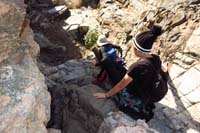 36-scrambling_down_dry_waterfall-closer_to_vehicles