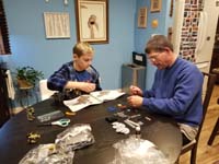 06-Daddy_helps_Kenny_build_a_Lego_he_received_for_Christmas-Daddy_sorts_and_divvies_out_the_pieces