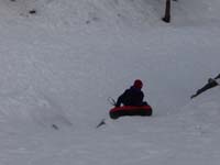 08-Kenny_tubing_down_the_hill