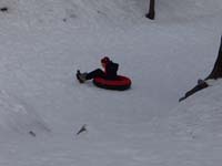 09-Kenny_tubing_down_the_hill