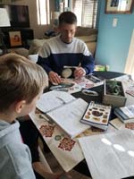 34-Daddy_helping_Kenny_with_Science_Olympiad_Fossils_event