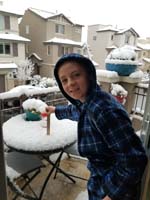 046-Kenny_measure_the_snow_on_balcony