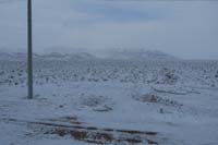 072-0812am-clouds_lifting_to_reveal_snow_covered_peaks