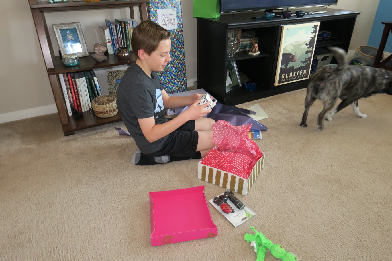 11-Kenny_opens_up_his_birthday_presents