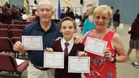 07-Kenny_shows_off_his_awards_with_help_from_Grammy_and_Grandpa_Duke